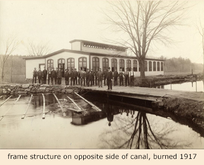 Snell workers at building along canal